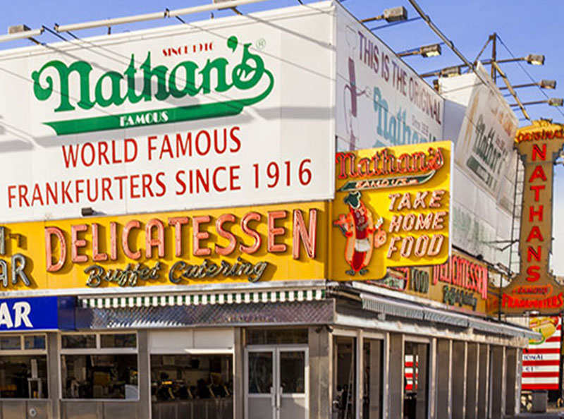 front marque of busy restaurant showcasing entrance and signage